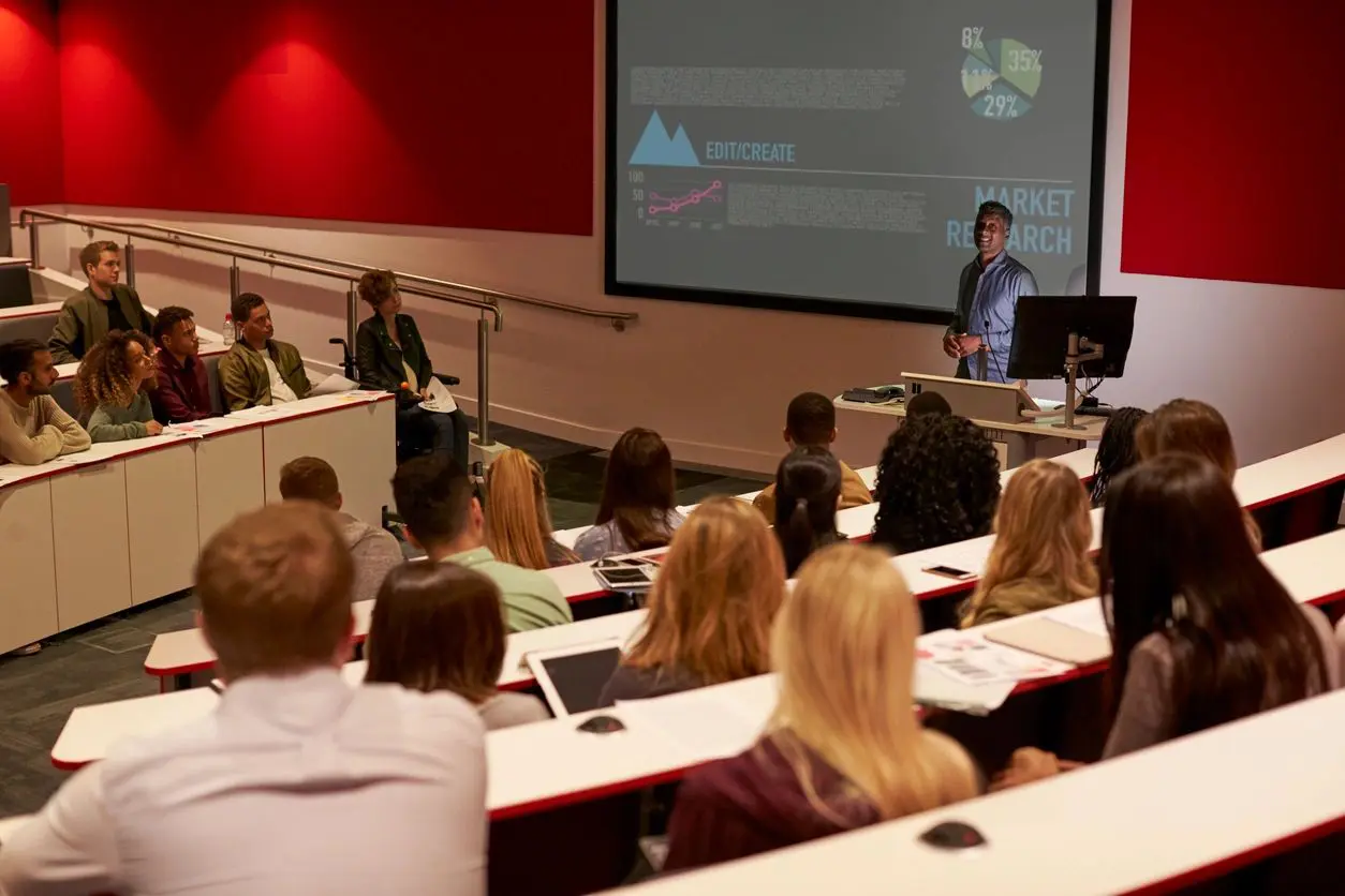 a man giving a presentation in the hall